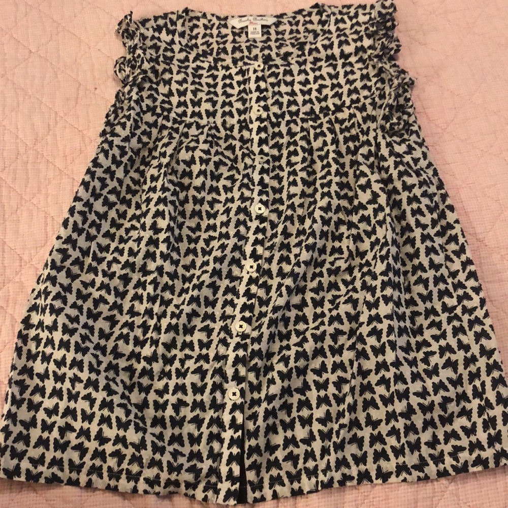 Brock’s Brothers sleeveless ruffle butterfly top